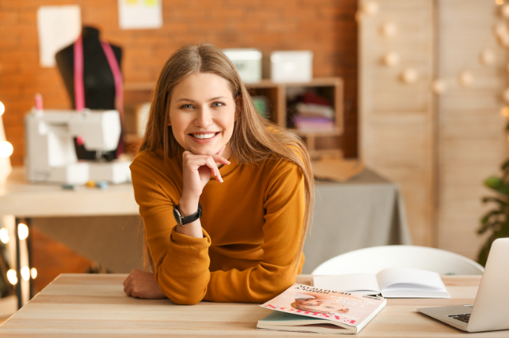 Image of a freelancing female smiling at the camera for the blog five steps to set the perfect foundations and become a freelancing boss